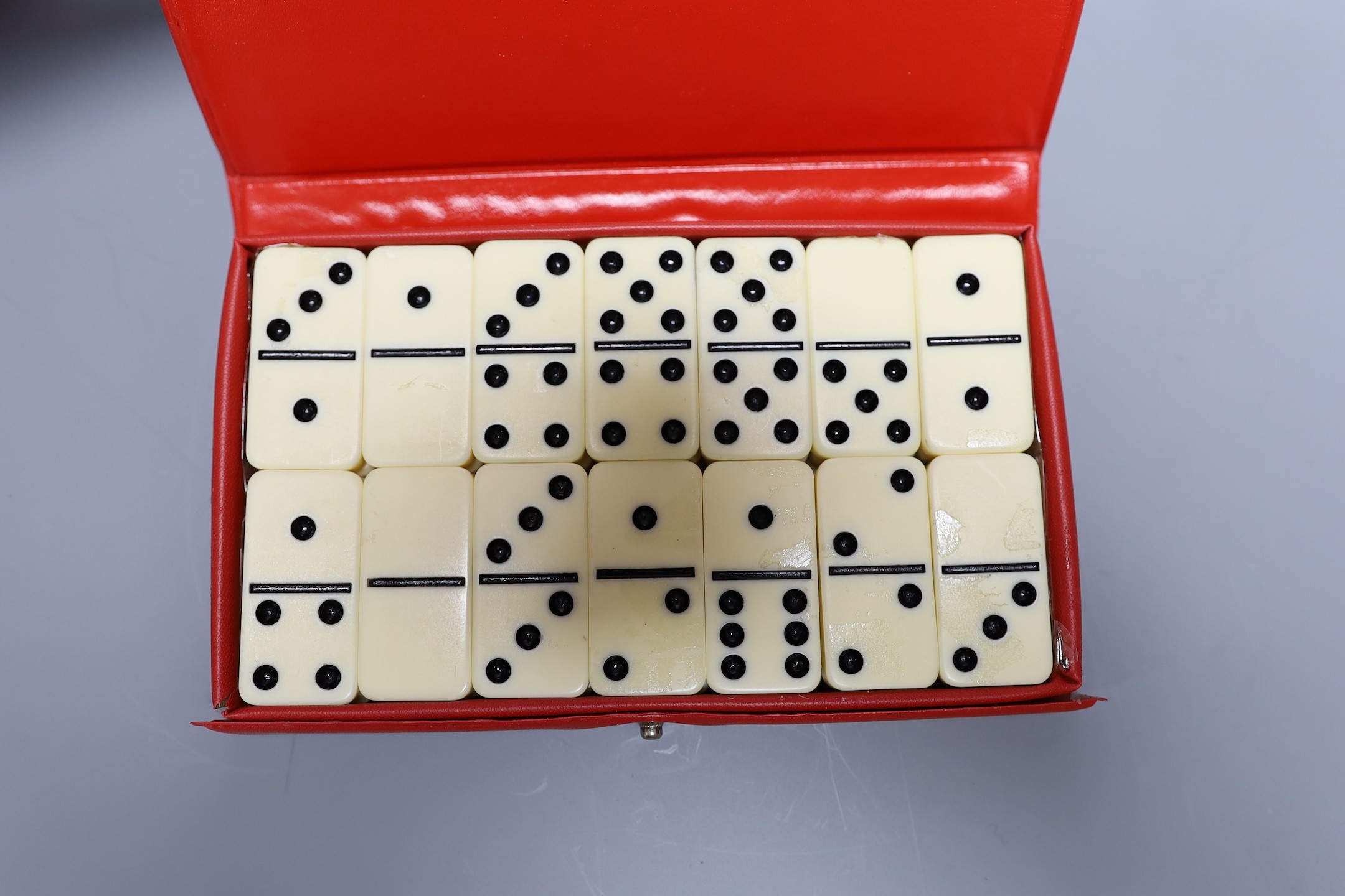 A Chinese carved wood chess set in carved mahogany box, together with three others and a dominoes set